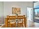 Cozy dining room with wood table and chairs, art piece, and modern decor at 923 Peachtree Ne St # 1628, Atlanta, GA 30309
