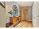 Stylish entryway with a decorative mirror, accent table, and hardwood floors, creating a welcoming ambiance at 923 Peachtree Ne St # 1628, Atlanta, GA 30309