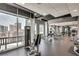 Modern gym featuring weight machines, a large window with city views, and plenty of natural light at 923 Peachtree Ne St # 1628, Atlanta, GA 30309