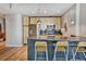 Open kitchen with stainless steel appliances, wooden cabinets, and a breakfast bar at 923 Peachtree Ne St # 1628, Atlanta, GA 30309