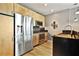 Contemporary kitchen with stainless steel appliances, black granite countertops, and wooden cabinetry at 923 Peachtree Ne St # 1628, Atlanta, GA 30309