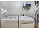 Well-equipped laundry room with side by side washer and dryer at 923 Peachtree Ne St # 1628, Atlanta, GA 30309