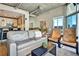 Spacious living room with wood floors, modern decor, and a view of the city at 923 Peachtree Ne St # 1628, Atlanta, GA 30309