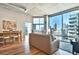 Bright and airy living room featuring hardwood floors, modern decor and stunning city views at 923 Peachtree Ne St # 1628, Atlanta, GA 30309