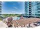 Outdoor lounge and pool area with mature trees and manicured landscaping at 923 Peachtree Ne St # 1628, Atlanta, GA 30309