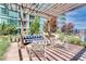Rooftop outdoor lounge area with comfortable seating, pergola, and lush landscaping at 923 Peachtree Ne St # 1628, Atlanta, GA 30309