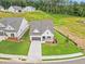 An aerial view of a single-Gathering home with a well-manicured lawn and a neighborhood setting at 1101 Cooks Farm Way, Woodstock, GA 30189