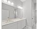Bathroom featuring double sinks and a large mirror at 1101 Cooks Farm Way, Woodstock, GA 30189