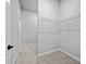 Spacious walk-in closet with wire shelving provides ample storage space at 1101 Cooks Farm Way, Woodstock, GA 30189