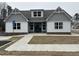 Charming community clubhouse featuring a gabled roof, gray siding, and a welcoming entrance at 1101 Cooks Farm Way, Woodstock, GA 30189