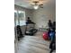 Well-equipped fitness room with hardwood floors, a treadmill, bike and free weights at 1101 Cooks Farm Way, Woodstock, GA 30189