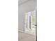 Open hallway provides seamless transition between rooms with bright views of the outside at 1101 Cooks Farm Way, Woodstock, GA 30189
