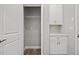 Convenient pantry offering plenty of shelving and countertop space for storage and food preparation at 1101 Cooks Farm Way, Woodstock, GA 30189