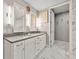 Bathroom featuring double vanity sinks and white marble floors, with a view of a nearby closet at 270 17Th Nw St # 2804, Atlanta, GA 30363