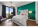 Bright bedroom featuring a queen bed, floor-to-ceiling windows, and a colorful accent wall at 270 17Th Nw St # 2804, Atlanta, GA 30363