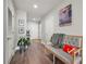 Inviting hallway featuring hardwood floors, decorative accents, and stylish furniture at 270 17Th Nw St # 2804, Atlanta, GA 30363
