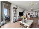 Living room leading to a balcony, hardwood floors, and kitchen in the background at 270 17Th Nw St # 2804, Atlanta, GA 30363