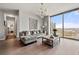 Stylish living room with a large window, hardwood floors and comfortable seating arrangement at 270 17Th Nw St # 2804, Atlanta, GA 30363