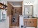 Bathroom featuring a walk-in tiled shower and granite countertop vanity at 525 Waters Way, Fayetteville, GA 30215