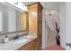 Elegant bathroom featuring granite countertops, a single sink vanity, and a tiled walk-in shower at 525 Waters Way, Fayetteville, GA 30215