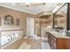 Luxurious bathroom boasting a soaking tub, walk-in shower, and neutral color palette at 525 Waters Way, Fayetteville, GA 30215