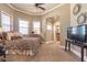Relaxing bedroom with neutral walls, large windows, and an ensuite bathroom entrance at 525 Waters Way, Fayetteville, GA 30215
