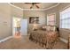 Inviting bedroom bathed in natural light, features a cozy color palette, and an adjoining bathroom at 525 Waters Way, Fayetteville, GA 30215