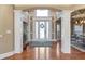 View of a spacious foyer with an impressive doorway and hardwood floors at 525 Waters Way, Fayetteville, GA 30215