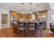 Spacious kitchen with custom cabinetry, granite countertops, stainless steel appliances, and a functional center island at 525 Waters Way, Fayetteville, GA 30215