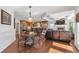 Spacious living area with a stone fireplace, open floorplan, and an adjacent dining area for easy entertainment at 525 Waters Way, Fayetteville, GA 30215