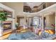 Open-concept living room featuring a fireplace and a view of the upper level at 525 Waters Way, Fayetteville, GA 30215