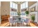 Beautifully designed living room with tall windows, fireplace, hardwood flooring, and elegant decor at 525 Waters Way, Fayetteville, GA 30215