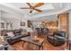 Inviting open-concept living room features hardwood floors, tray ceilings, and seamless access to the gourmet kitchen at 525 Waters Way, Fayetteville, GA 30215