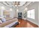 Bright main bedroom showcasing a decorative ceiling, hardwood floors, and lots of natural light at 525 Waters Way, Fayetteville, GA 30215