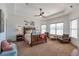 Bright and airy main bedroom suite boasts a ceiling fan, lots of natural light, and a relaxing atmosphere at 525 Waters Way, Fayetteville, GA 30215