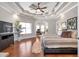 Bright main bedroom showcasing a decorative ceiling, hardwood floors, and lots of natural light at 525 Waters Way, Fayetteville, GA 30215