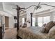 Bright main bedroom with a canopy bed, tray ceiling, and a view from the pillows at 525 Waters Way, Fayetteville, GA 30215