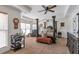 Main bedroom with tray ceiling, sitting area, and large windows at 525 Waters Way, Fayetteville, GA 30215