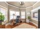 Cozy home office with hardwood floors, a fireplace, and natural light at 525 Waters Way, Fayetteville, GA 30215