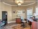 A home office features a neutral palette, a Persian-style rug, and natural light at 525 Waters Way, Fayetteville, GA 30215