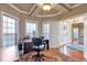 A home office boasts a bay window, natural light, and direct access to the main house at 525 Waters Way, Fayetteville, GA 30215