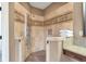 Modern shower features tiled walls and a rainfall shower head at 525 Waters Way, Fayetteville, GA 30215