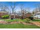 Expansive backyard featuring a patio area, barbecue grill, and lush green space at 731 Fern Se St, Marietta, GA 30067
