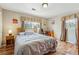 Relaxing bedroom with a comfortable bed, natural light, and hardwood floors at 731 Fern Se St, Marietta, GA 30067