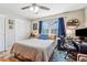 Comfortable bedroom with a ceiling fan, ample natural light, and hardwood flooring at 731 Fern Se St, Marietta, GA 30067