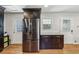 Contemporary kitchen featuring stainless steel refrigerator and dark wood cabinets at 731 Fern Se St, Marietta, GA 30067
