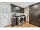 Well-equipped laundry area with modern front-load machines and granite countertops at 731 Fern Se St, Marietta, GA 30067