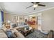 Cozy living room offering comfortable seating and an open layout leading to the dining area and staircase at 731 Fern Se St, Marietta, GA 30067