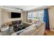 Comfortable living room featuring large window, ceiling fan, and neutral decor at 731 Fern Se St, Marietta, GA 30067