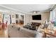 Cozy living room featuring hardwood floors, comfortable seating, and an open view into the dining area and kitchen at 731 Fern Se St, Marietta, GA 30067